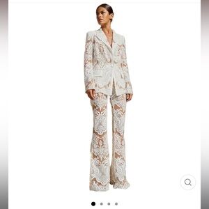 Elegant white lace and sequin two piece suit.